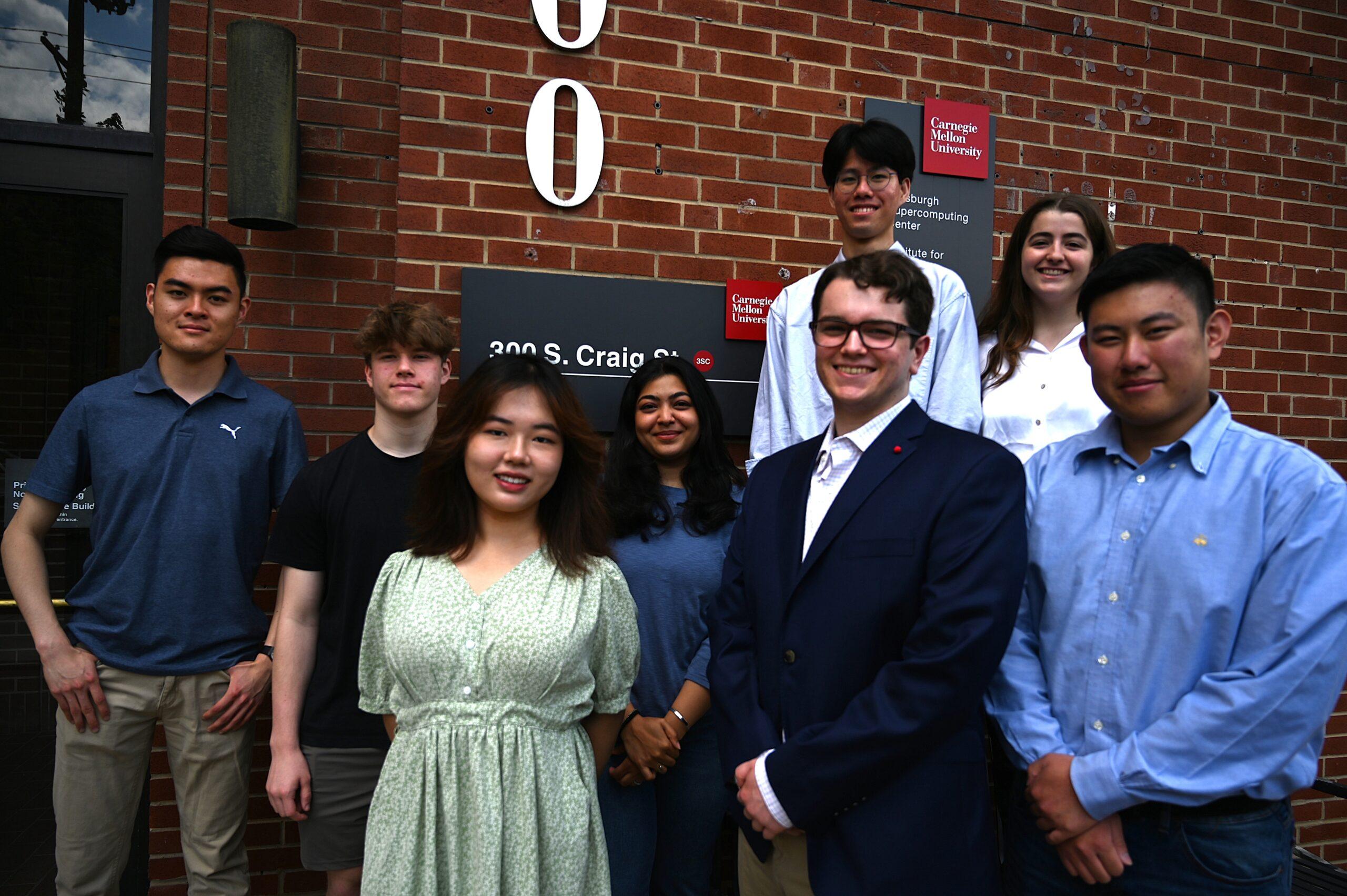 A group photo of 8 people. 
