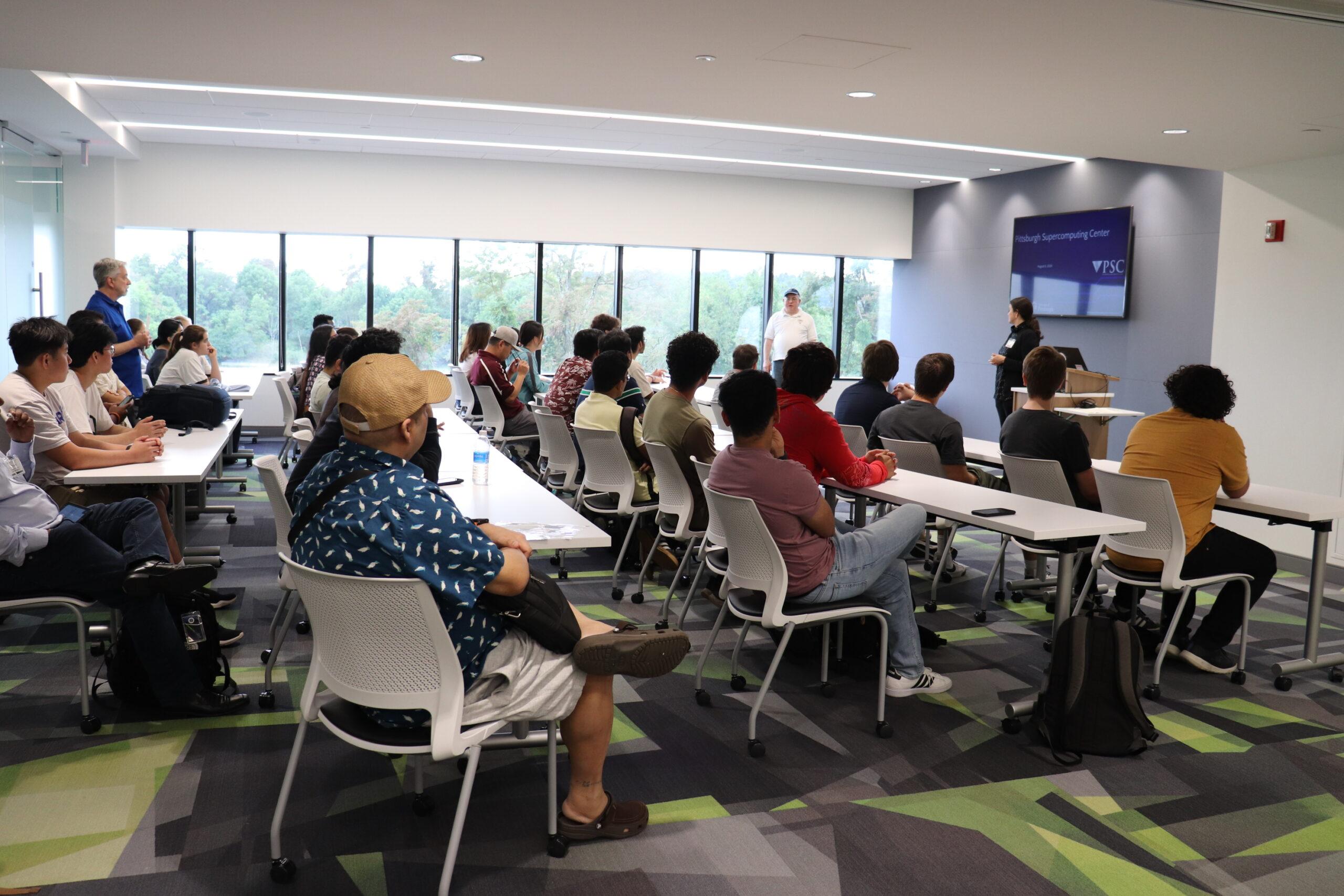 People attending a workshop in a classroom.