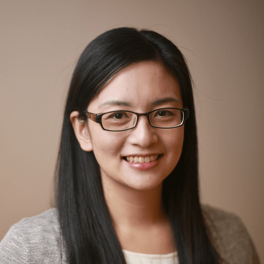 mei-yu A woman with light skin tone and black hair smiles at the camera.