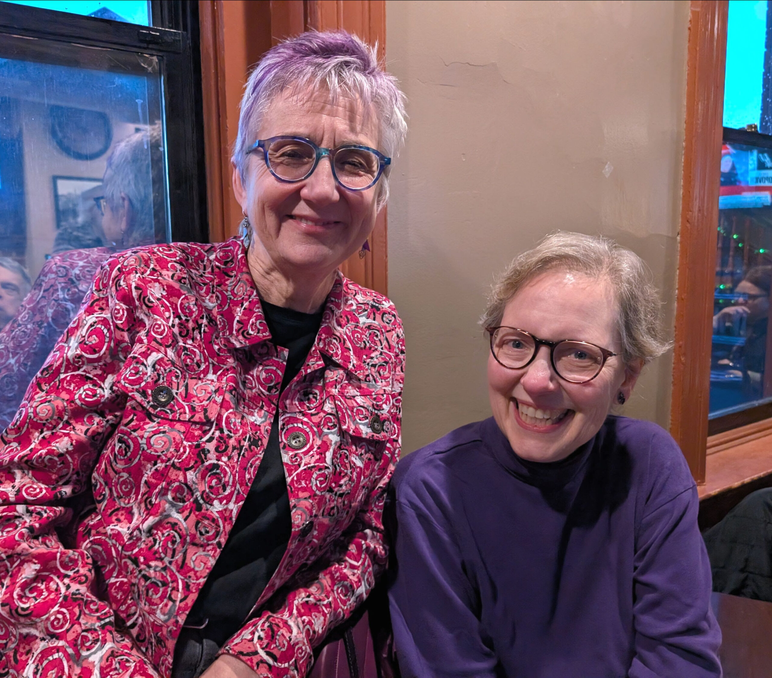 Two women smile for a photo