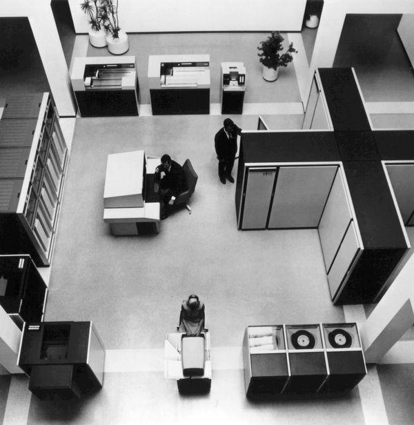Overhead view of a room with a large, t-shaped Control Data 6600 supercomputer.